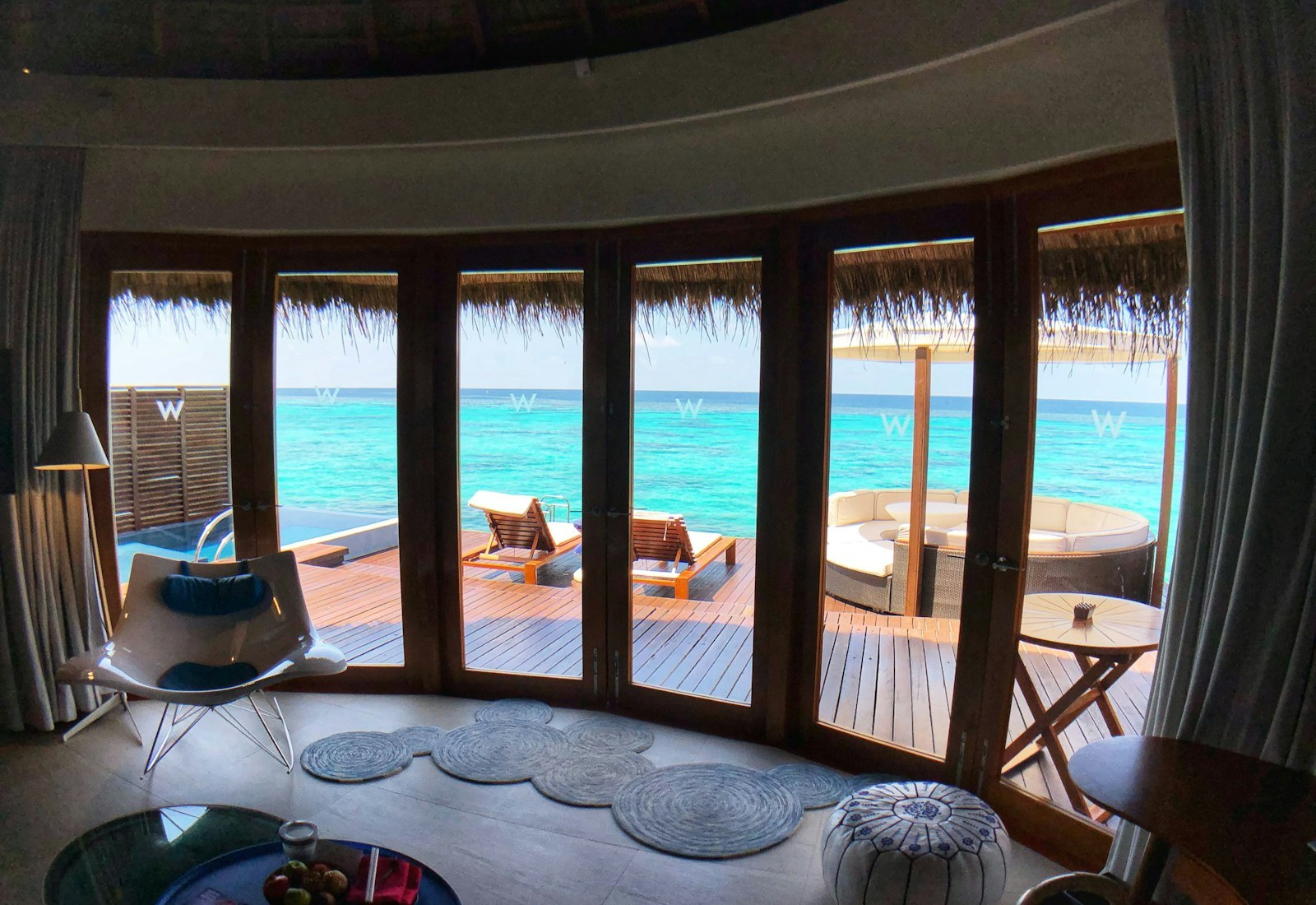 Private luxury villa interior overlooking turquoise water